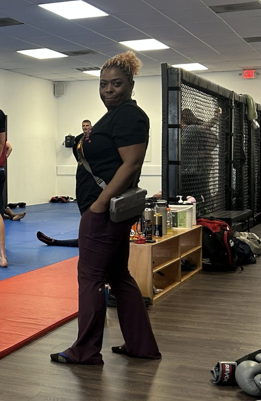 Tanja practicing close-range defense against a training partner